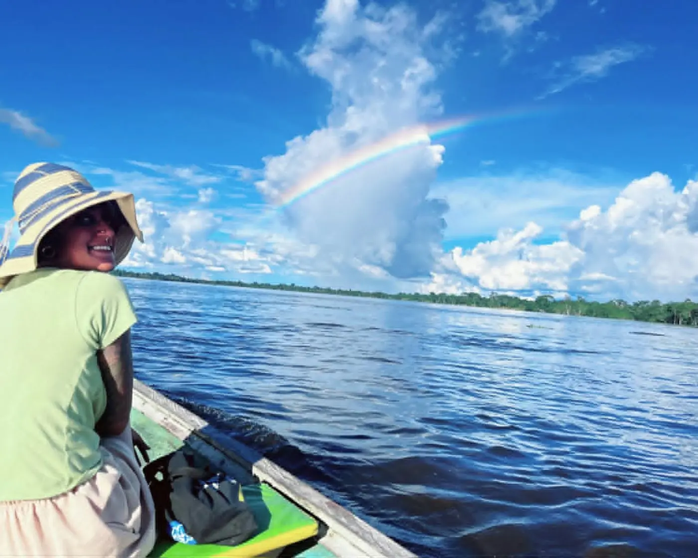 A rainbow over a broad Amazonian river.