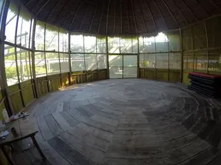 Open-air circular gathering space at the rainforest lodge.